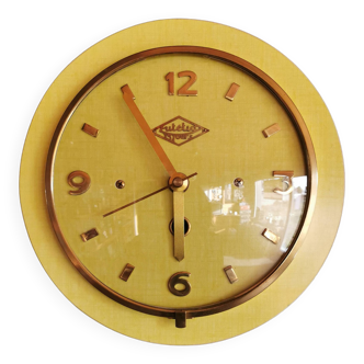 Vintage Formica clock round silent wall pendulum "Lutetia golden yellow"