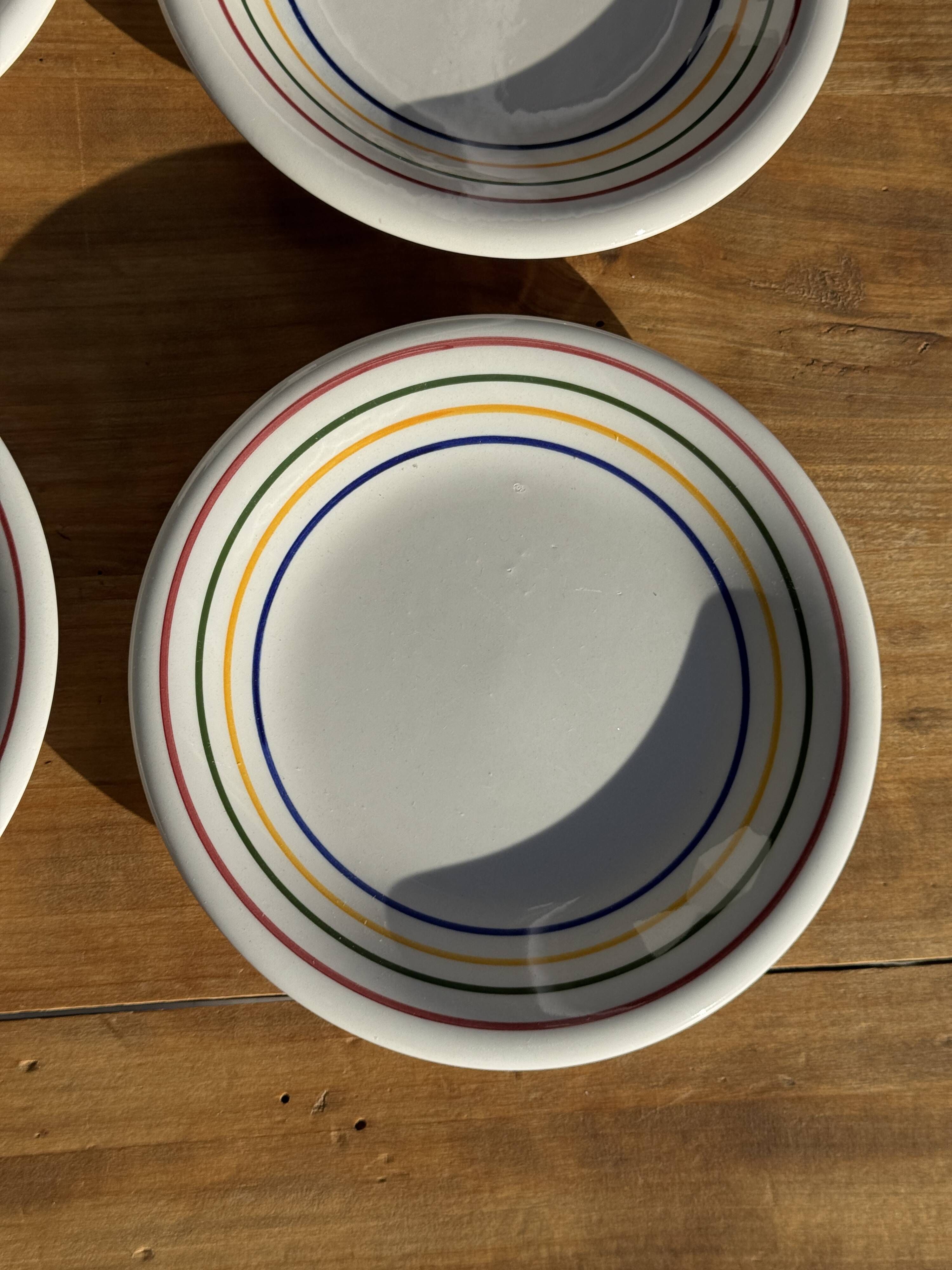 Set of 9 small Italian dessert plates Primula with red and green trim.