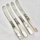 4 antique butter spreading knives in silver-plated metal and mother-of-pearl.