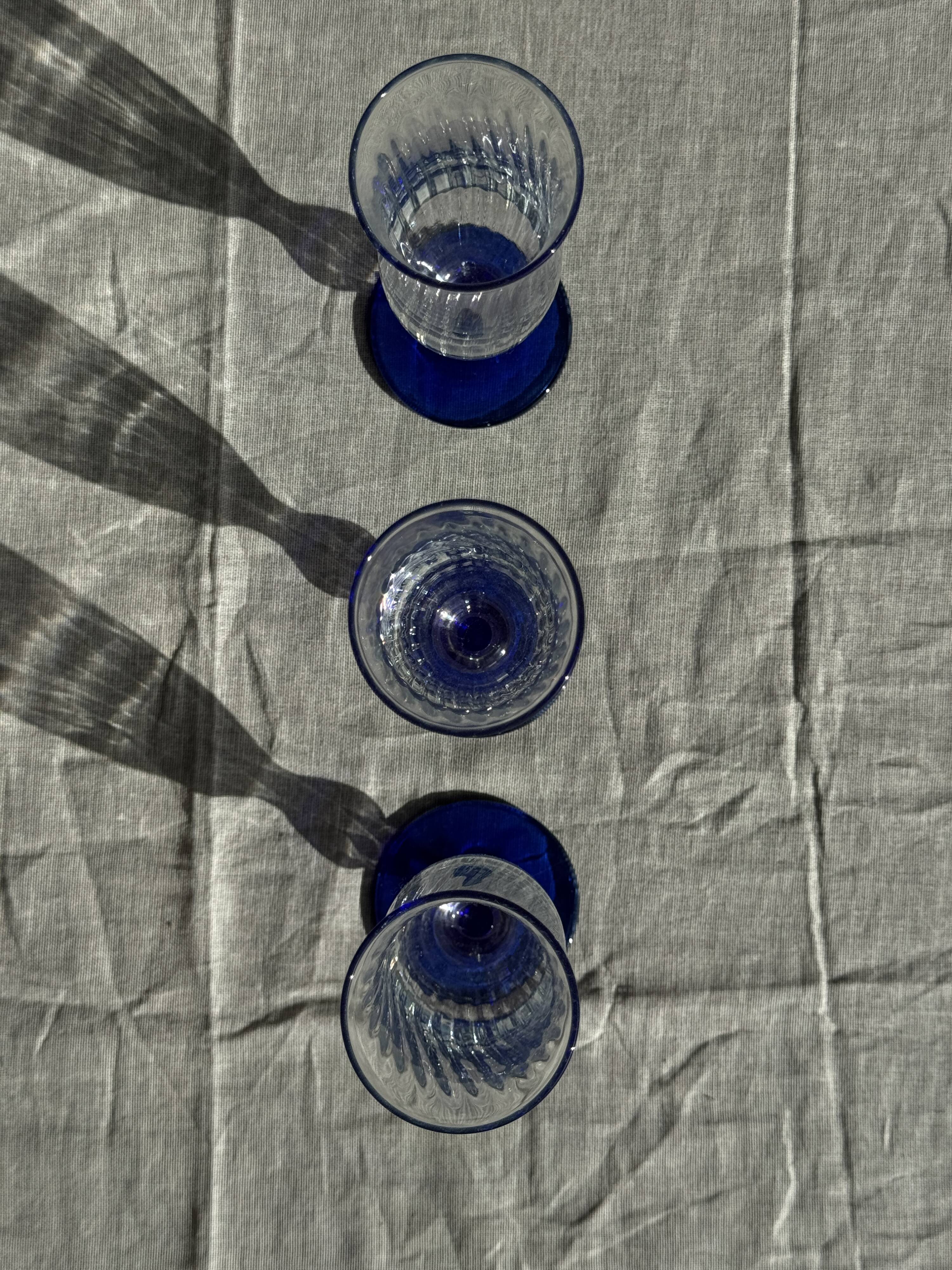 Set of 6 blue-footed champagne flutes; 3 pairs of designs.