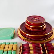 set of trivets, bottle coasters and knife holders in art de cherry-colored ceramic