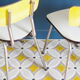 Série de 4 chaises en formica  bicolore jaune et blanc chiné
