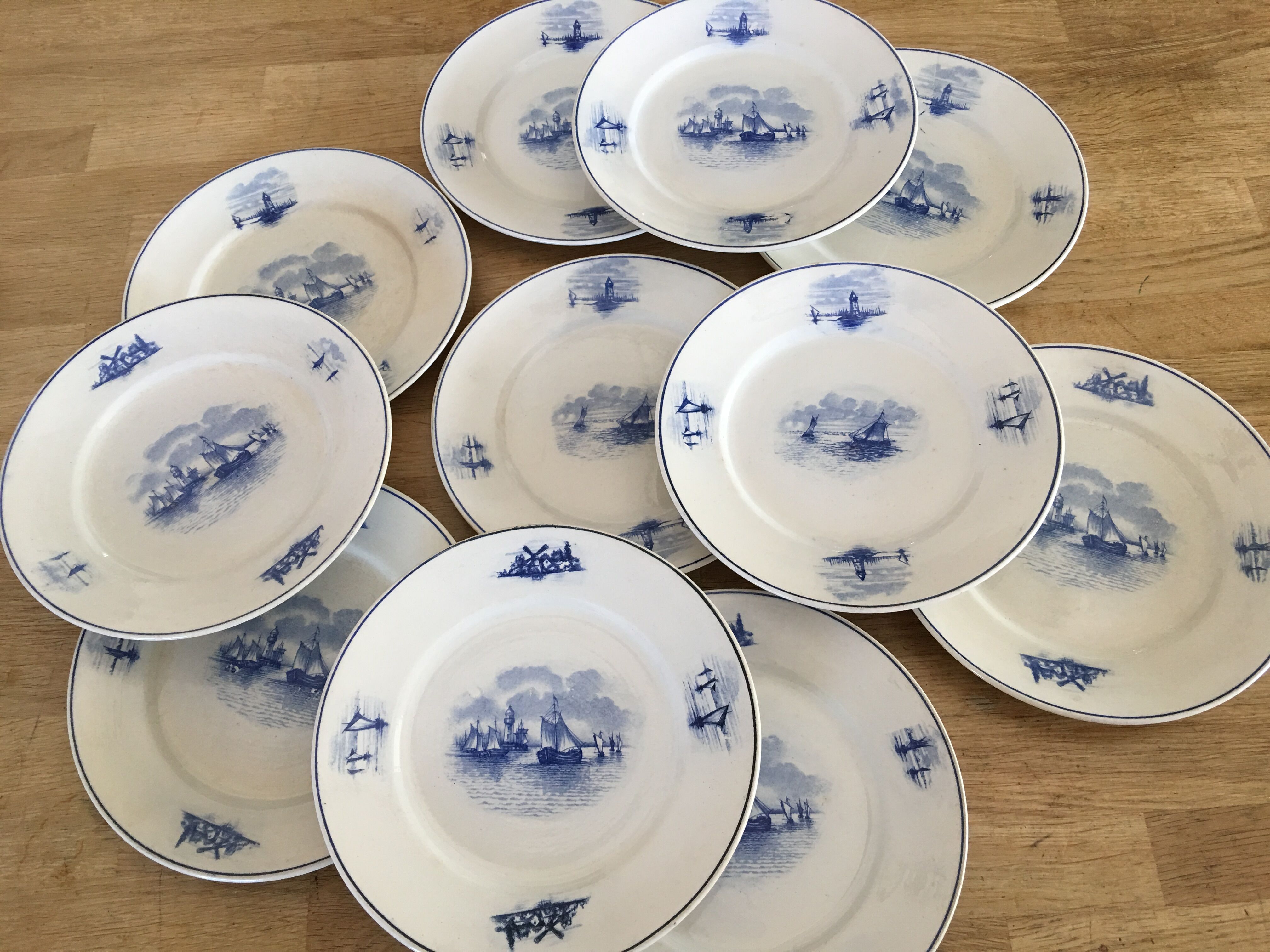 Series of 11 flat plates, Dutch earthenware, early XX
