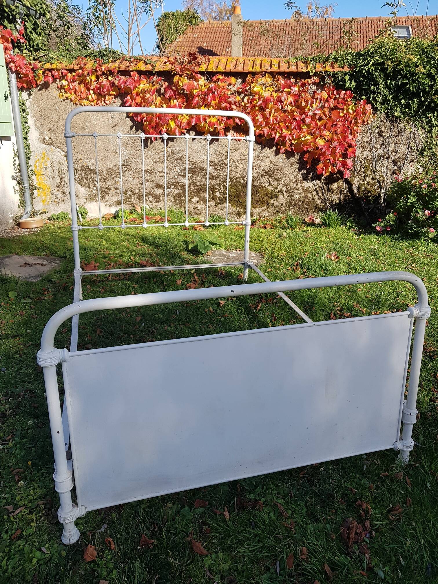 Old white metal bed from 1900