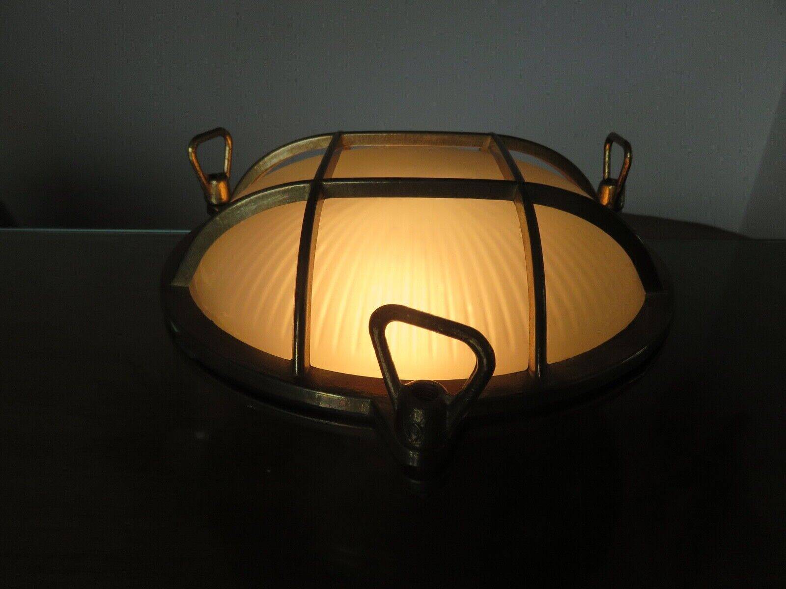 Brass porthole wall lamp