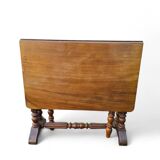 “Gateleg” folding walnut table