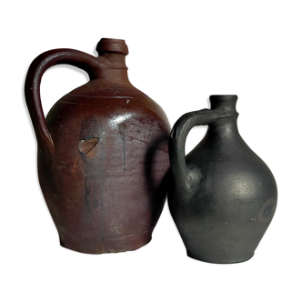 Duo of traditional pottery-bottles in ancient black sandstone