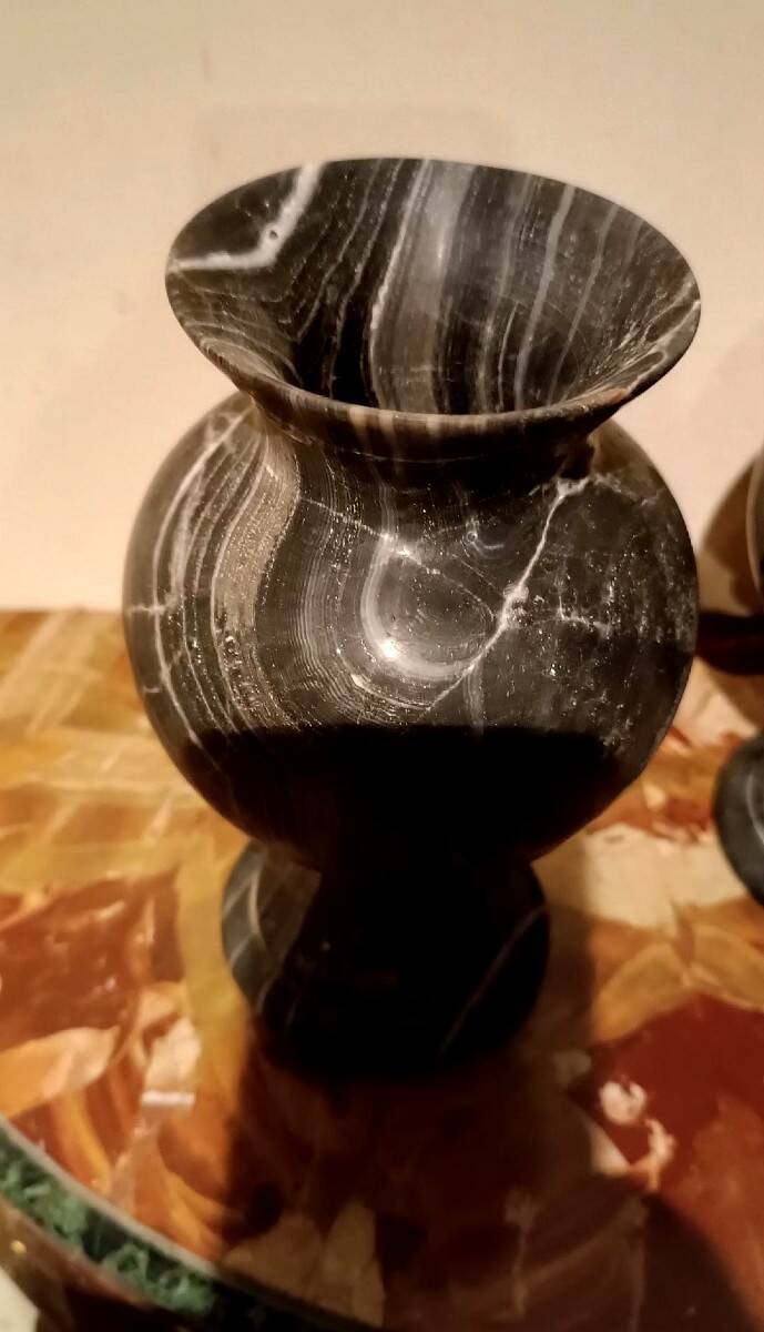Pair of black serpentine marble vase-urns, early 20th century, Empire style