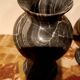 Pair of black serpentine marble vase-urns, early 20th century, Empire style