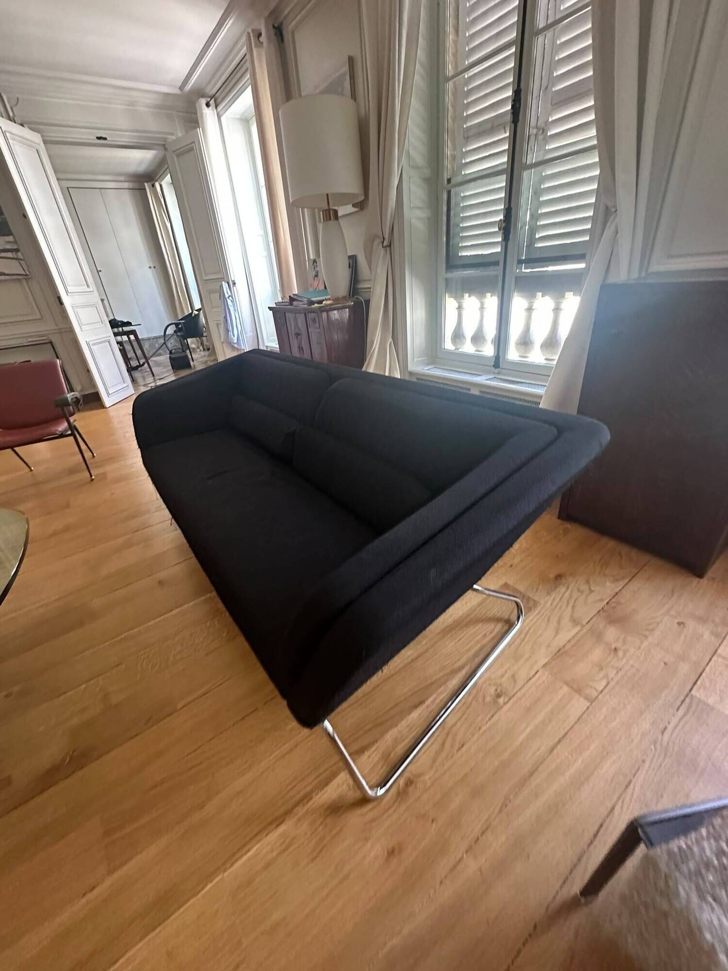 Black 3-seater sofa signed by a designer.