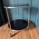 Vintage side table on wheels – black glass top