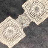 Transparent glass salt cellar with geometric patterns and rosettes