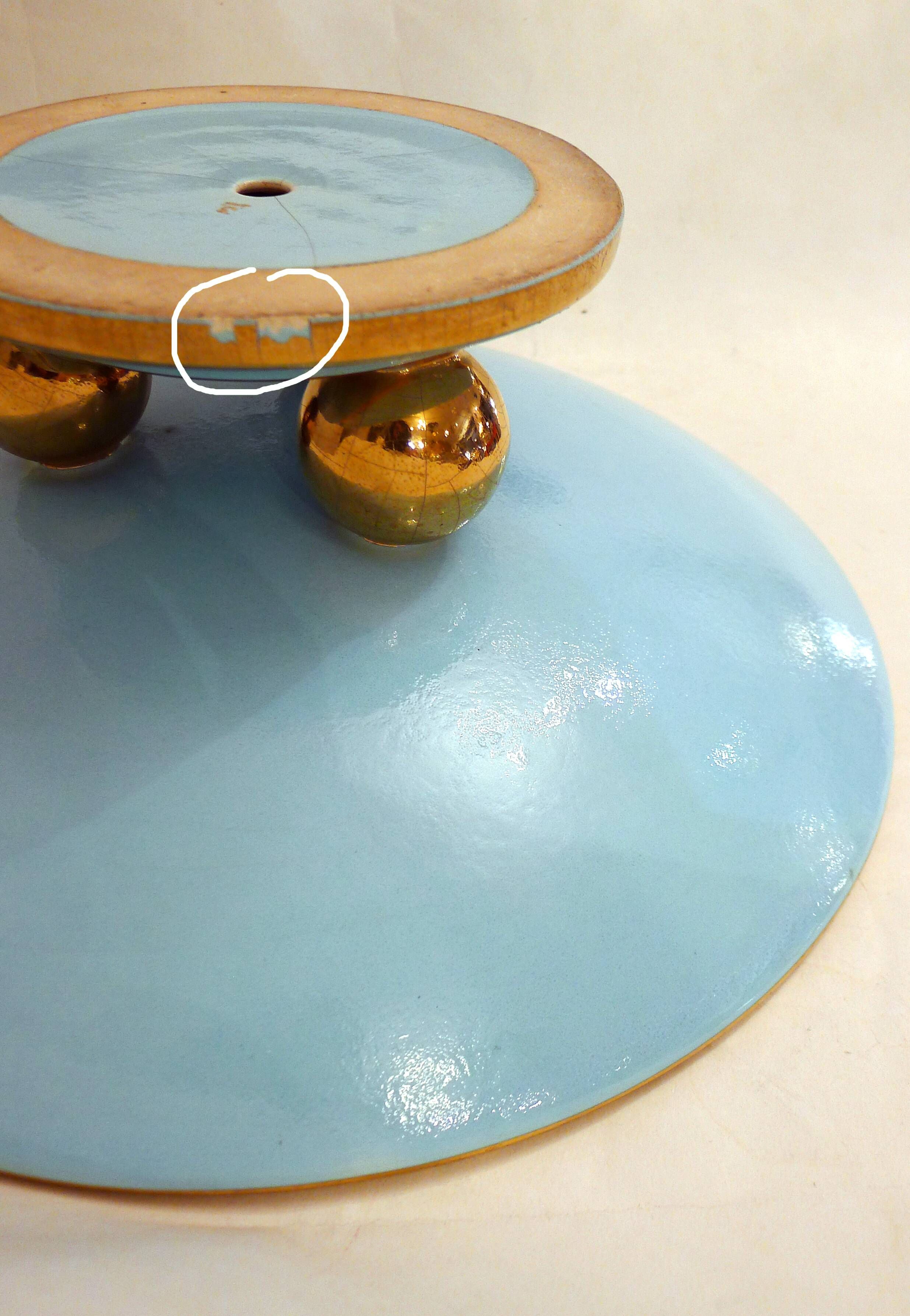 Art Deco modernist coupe, with a base of 3 spheres, in turquoise ceramic and gilding.