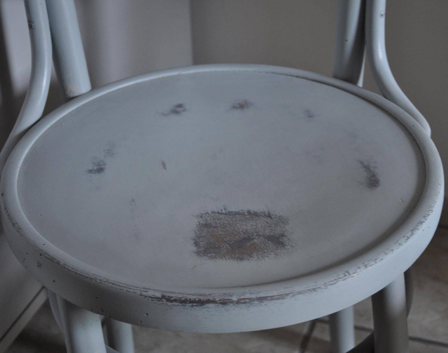 Pair of Lichtig bistro chairs in painted grey beech, pressed seat, circa 1900.