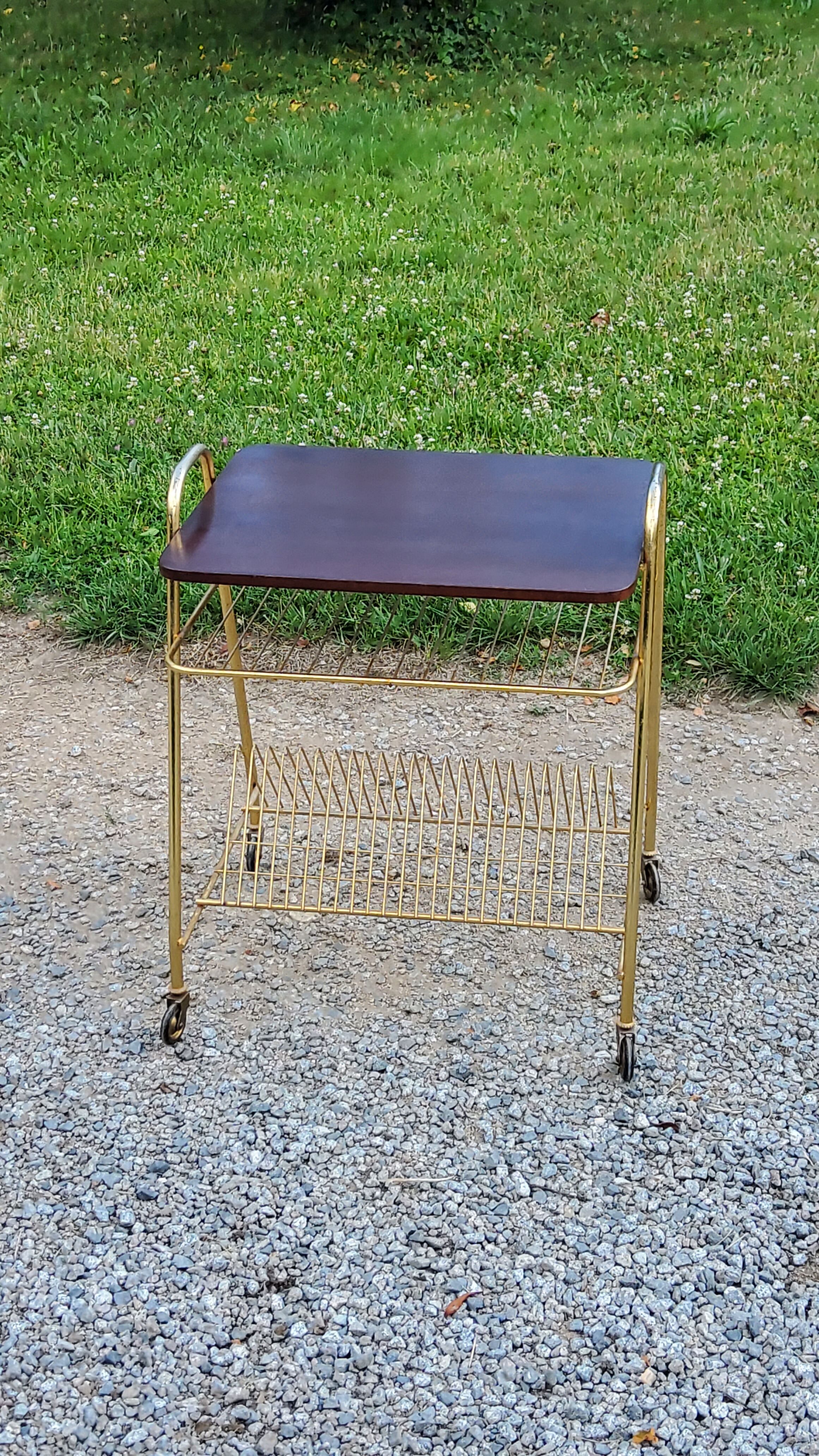 Side table of the 60s mahogany and gold metal range discs