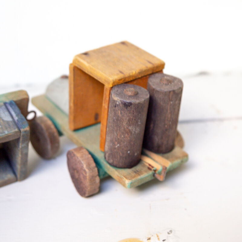 Old wooden train locomotive and toy trailer