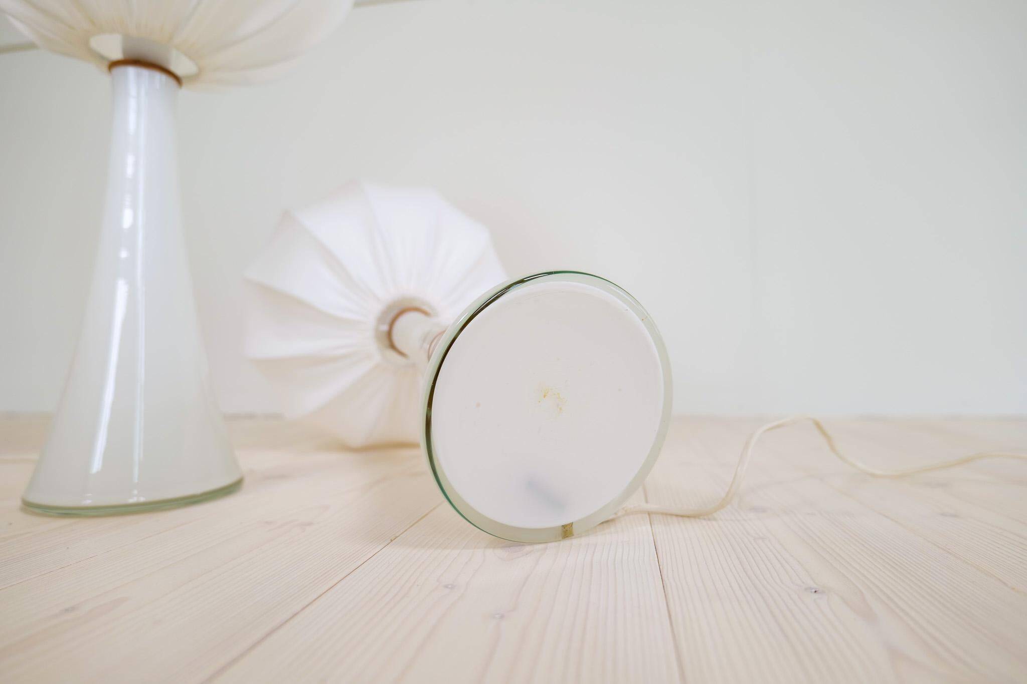 Pair of mid-century opaline glass table lamps with cotton shades by Bergboms, Sweden, 1960.