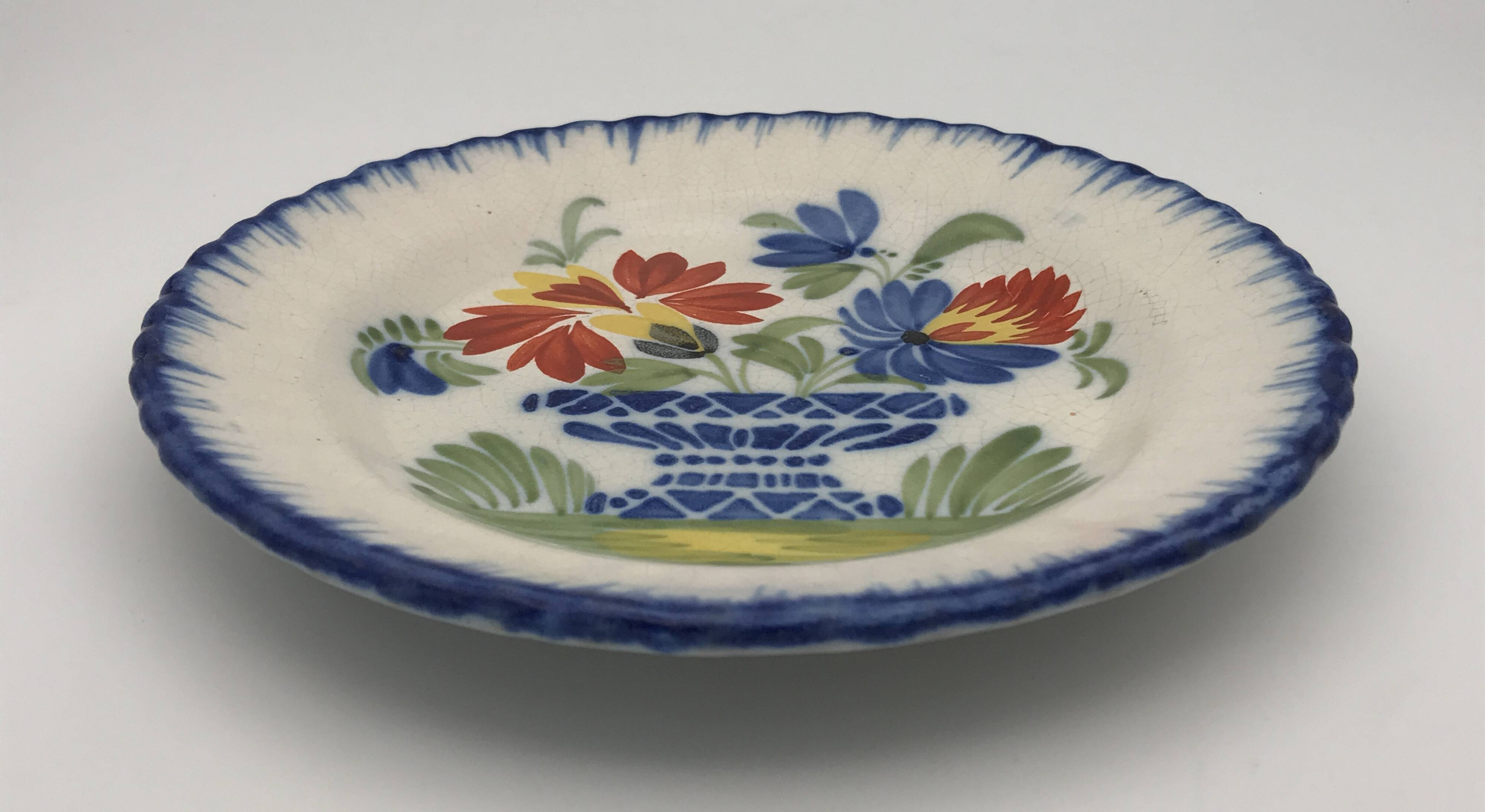 Antique auvillar earthenware plate decorated with basket of polychrome flowers