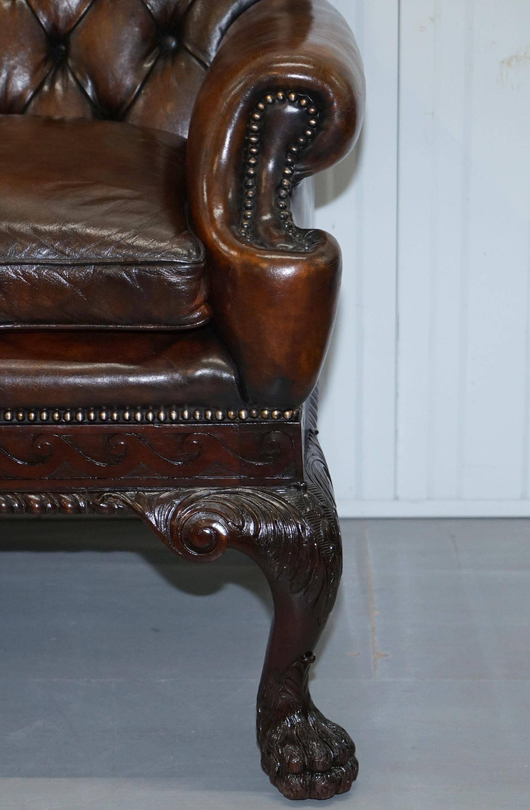 Chesterfield leather canapé in Georgian style with lion paw carved feet.