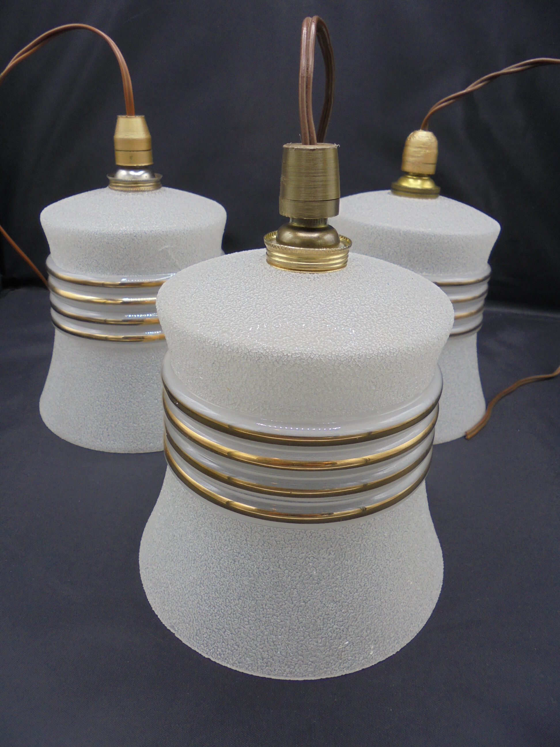 Trio of vintage suspensions