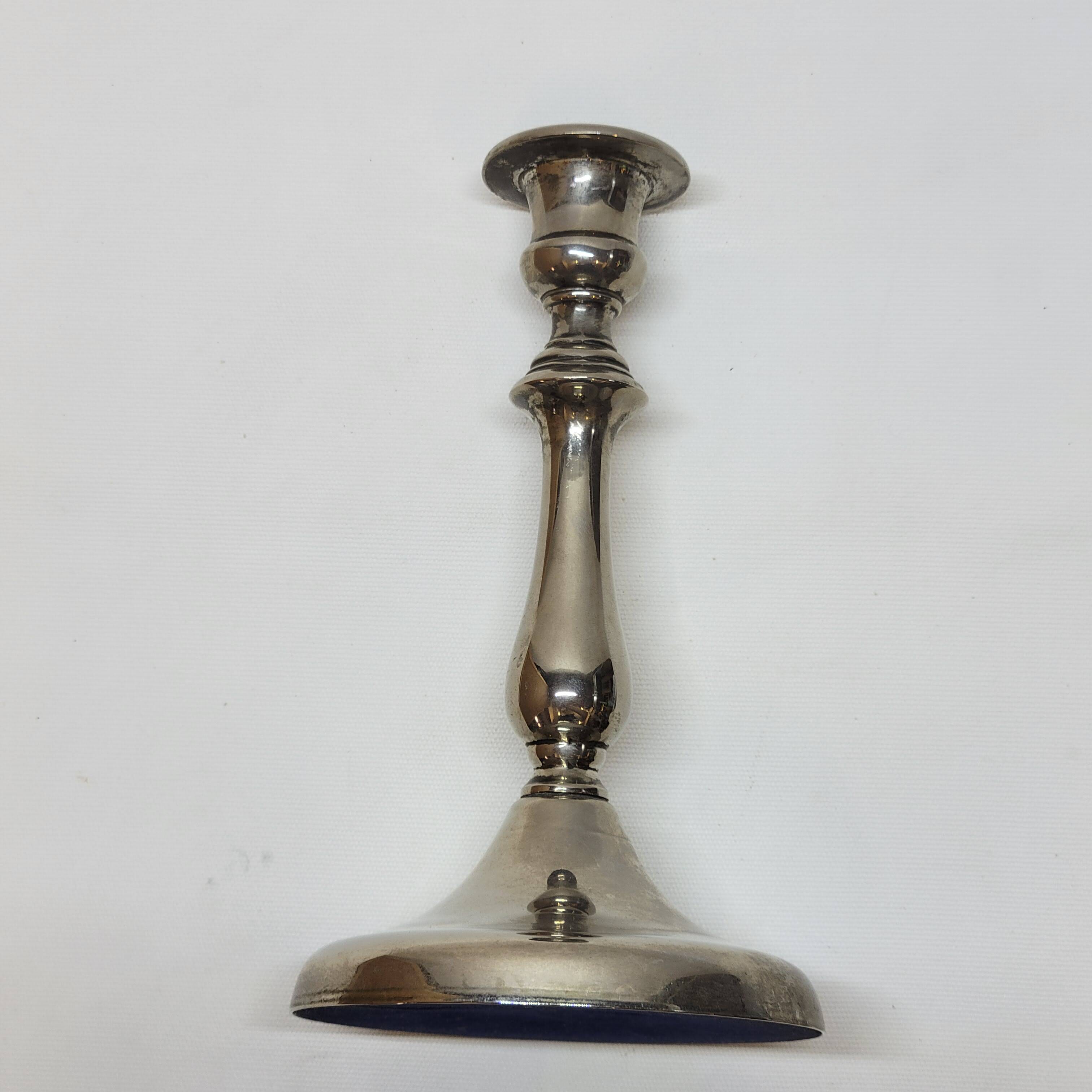 Old candle holder in silver metal