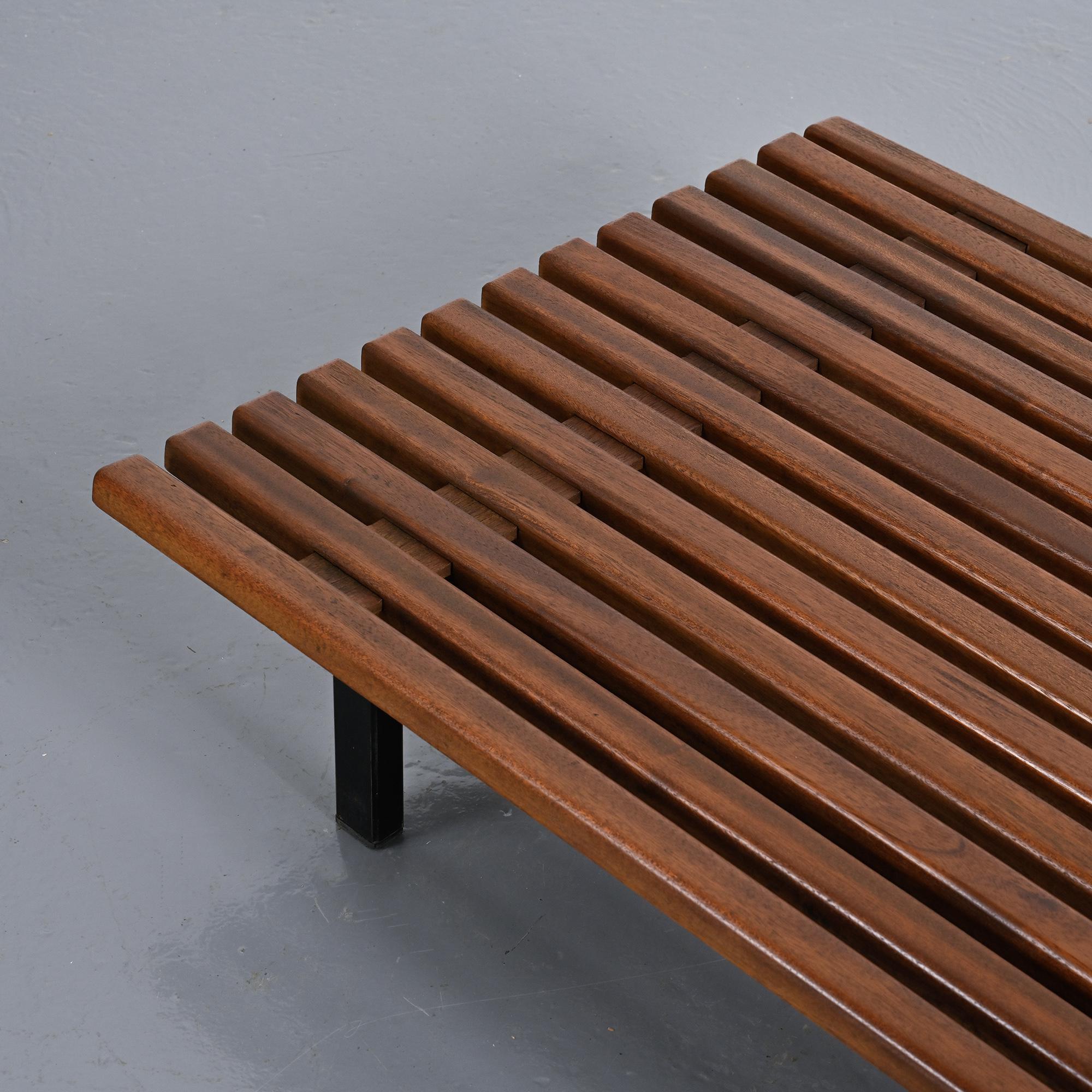 Cansado bench in mahogany by Charlotte Perriand, circa 1962.