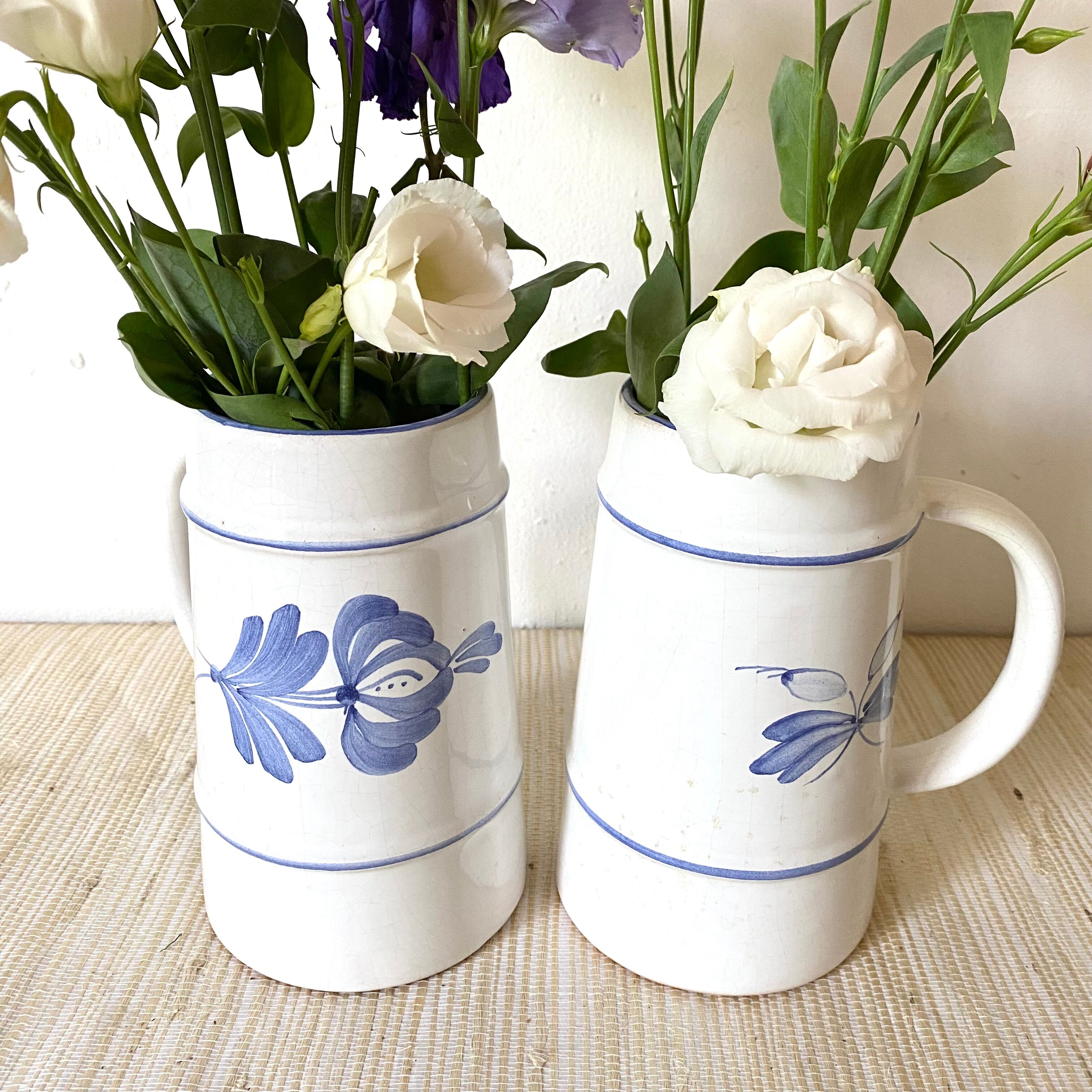 Flowery earthenware beer mugs