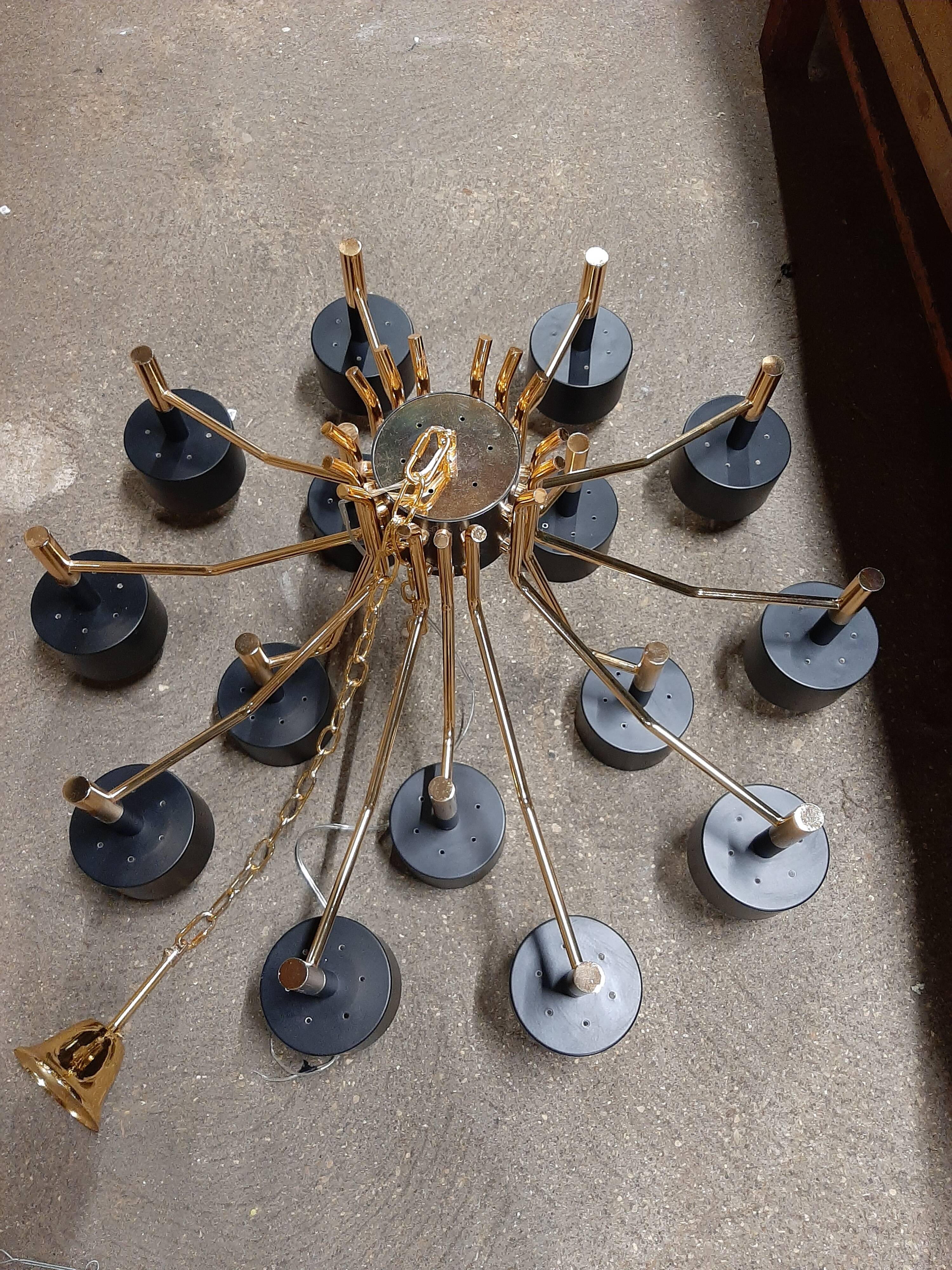 Black chandelier and gilded metal