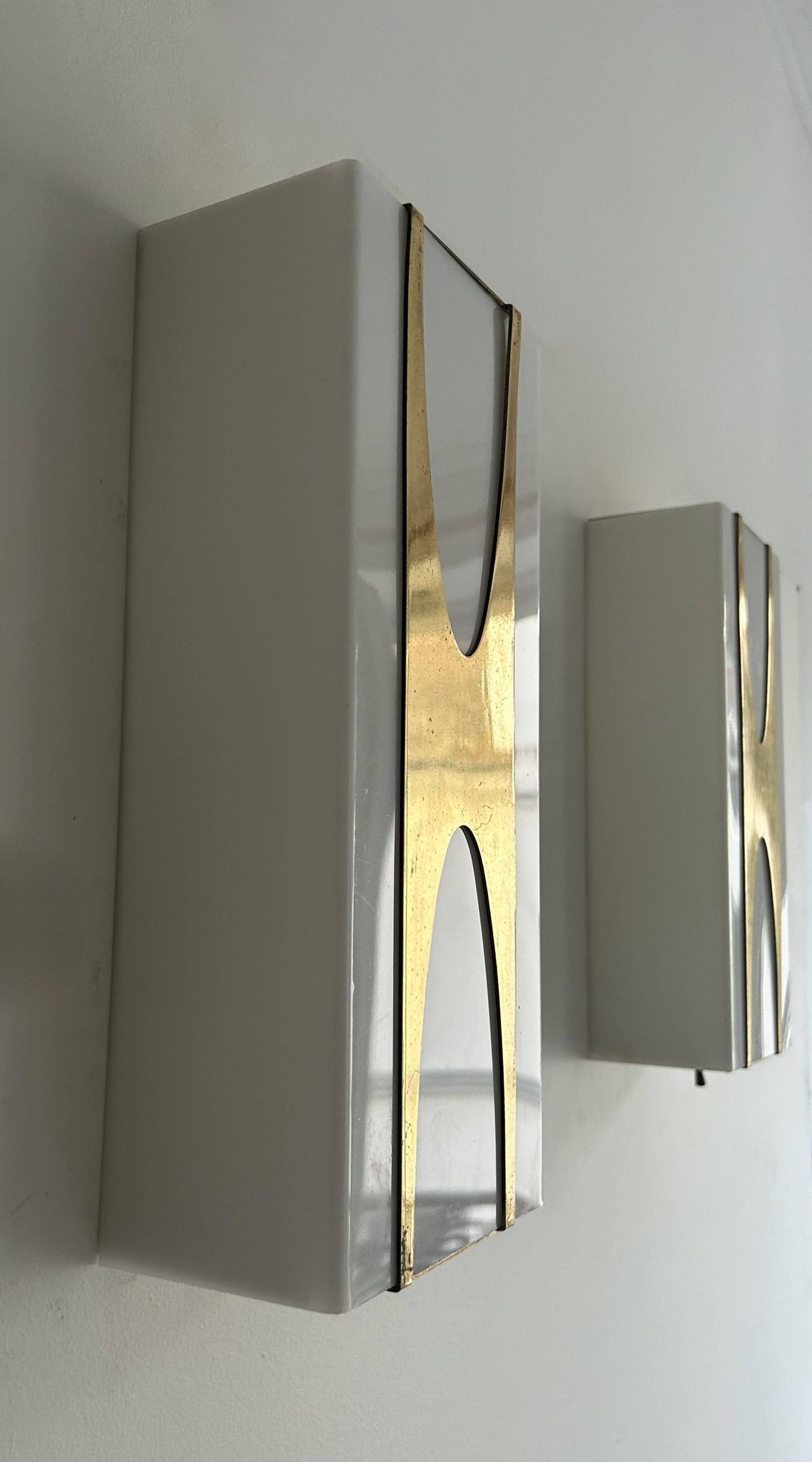 Pair of Loewy wall lights for Hilton, brass and Perspex, France 1965