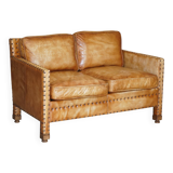 Two-seater leather canapé, hand-tanned, Edwardian style with studs.