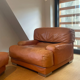 Paire de fauteuils vintage Gérard Guermonprez cuir fauve et inox, France 1970