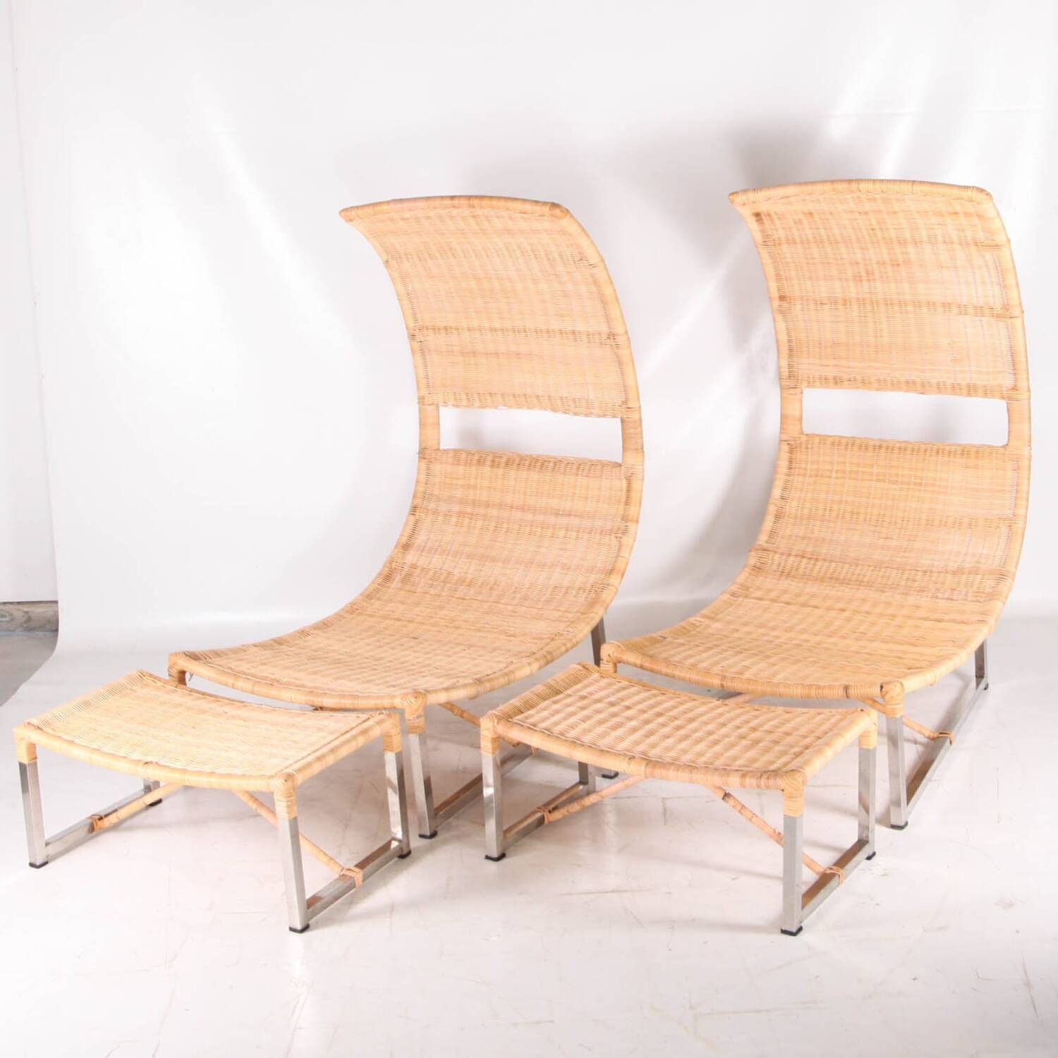 Pair of metal and rattan armchairs
