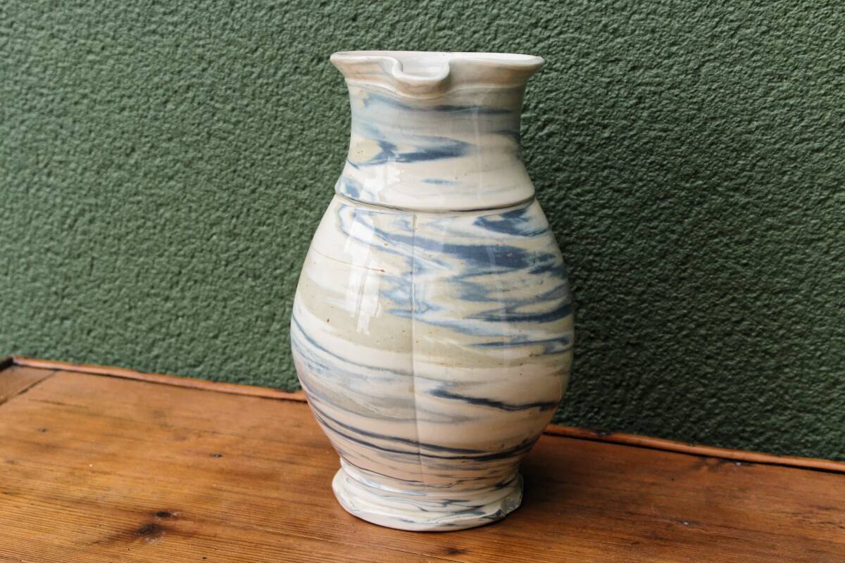 Water jug, signed, blue and white scrolls