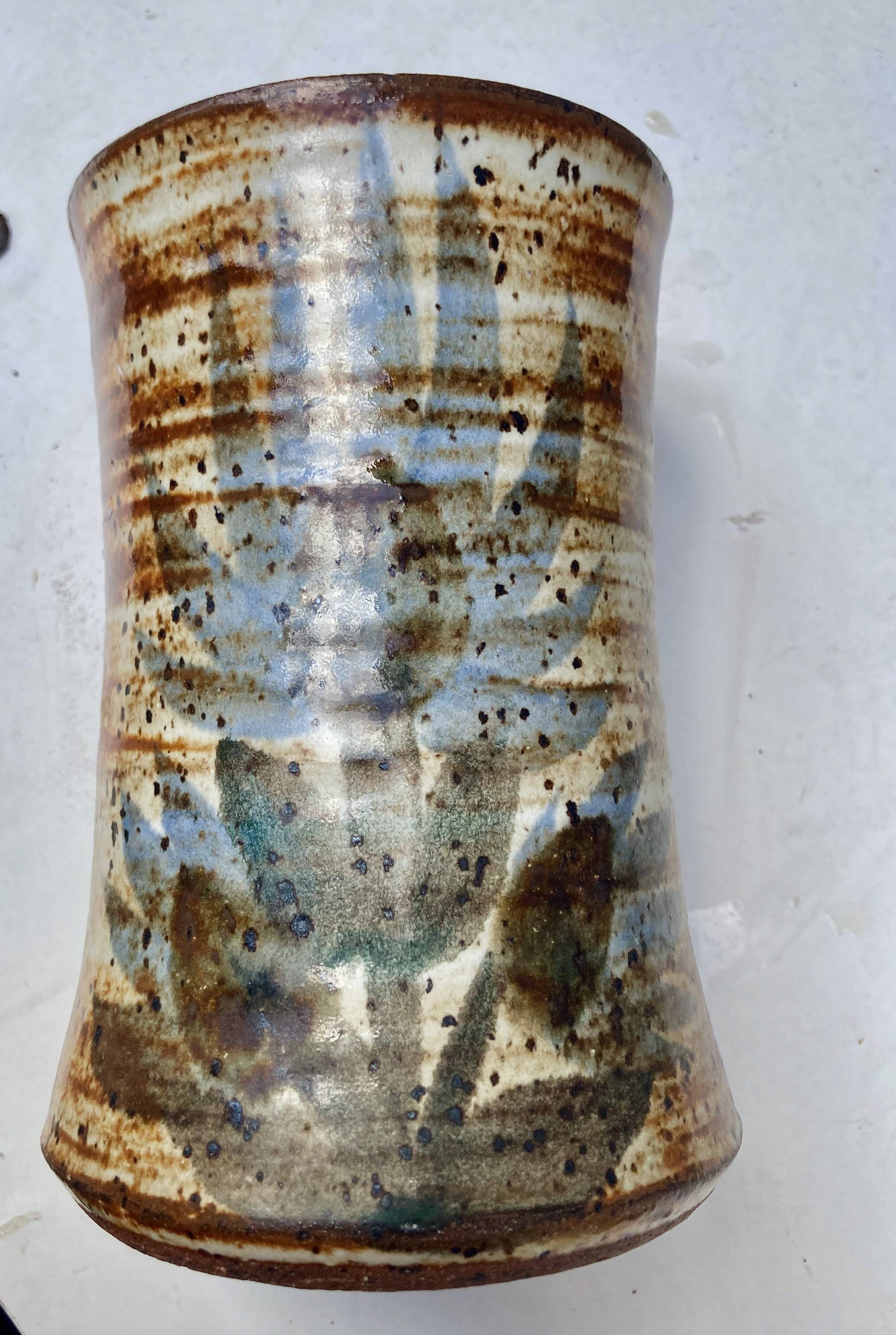 glazed ceramic vase with abstract flower decoration, signature to identify