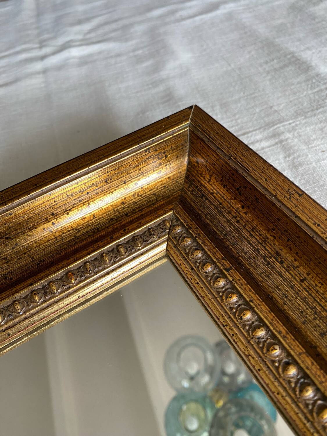 Bronze-colored framed mirror