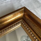 Bronze-colored framed mirror