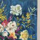 Bouquet on a blue background, oil on canvas signed Gisèle Renaut.