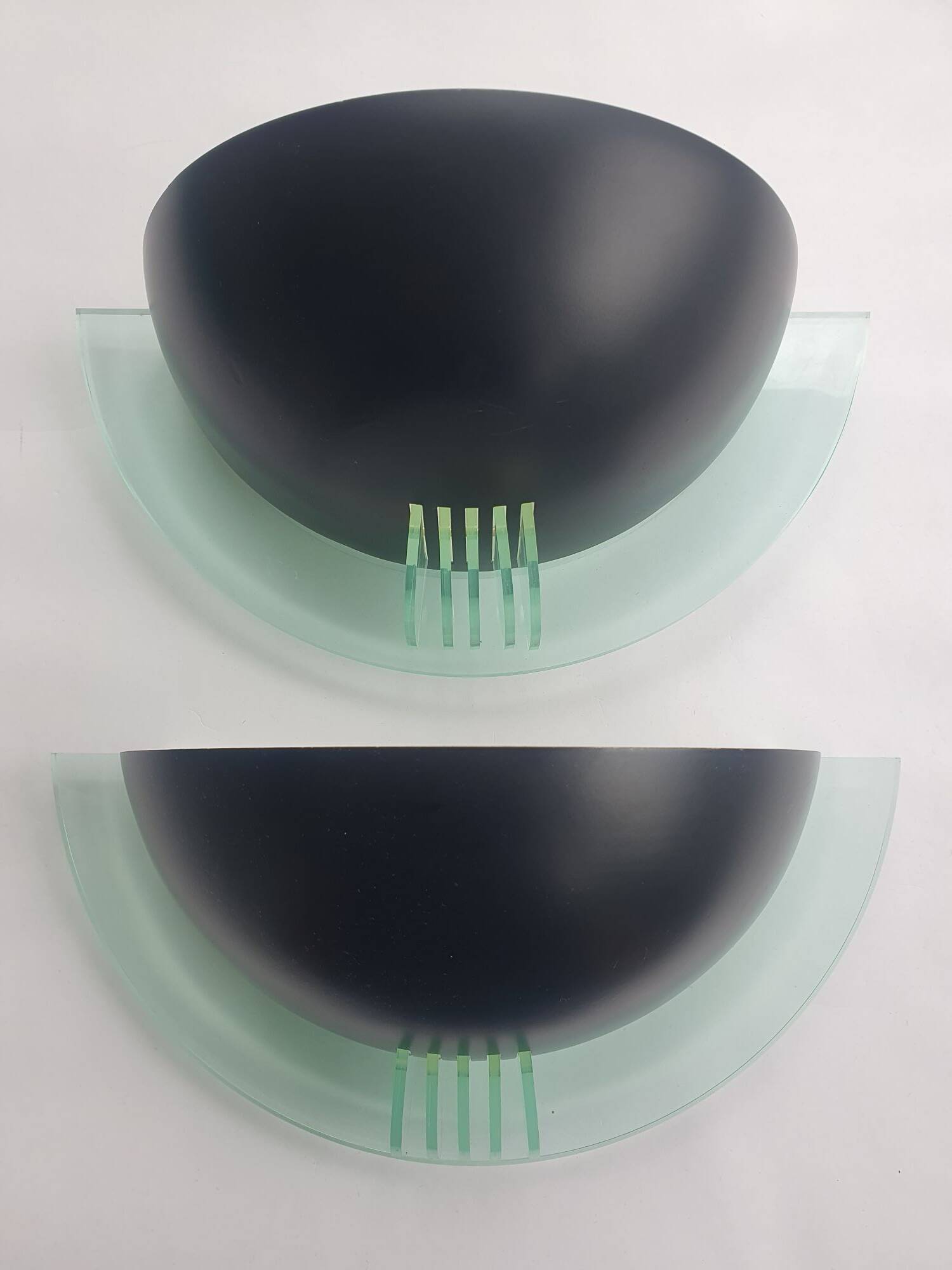 Pair of vintage black metal and plexiglass half-moon wall lights
