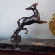 Art deco table lamp, marble, opaque glass and granite, animal in bronze patinated regulator