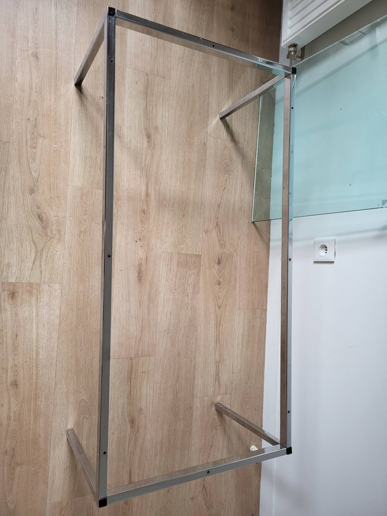 Knoll coffee table with smoked glass top and chrome metal.