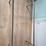 Knoll coffee table with smoked glass top and chrome metal.