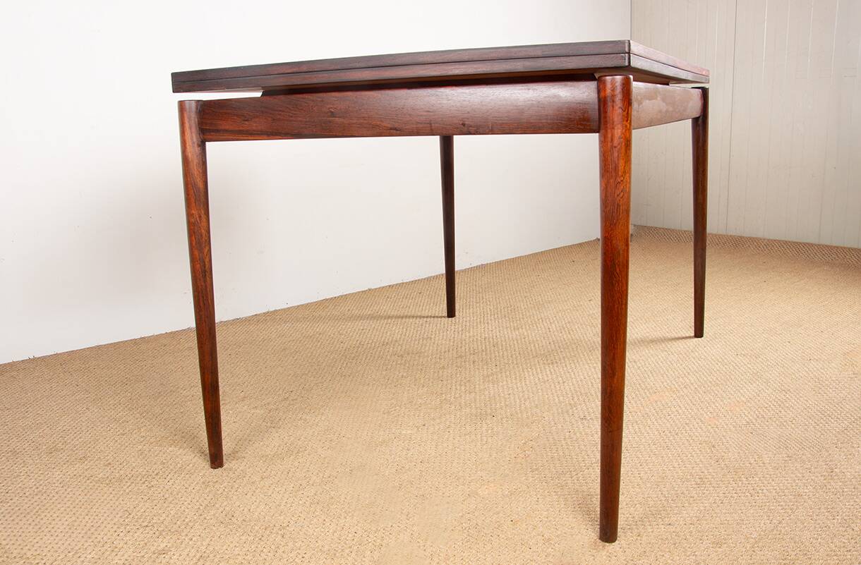 Danish extendable dining table in rosewood and brass by Poul Volther