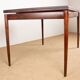 Danish extendable dining table in rosewood and brass by Poul Volther