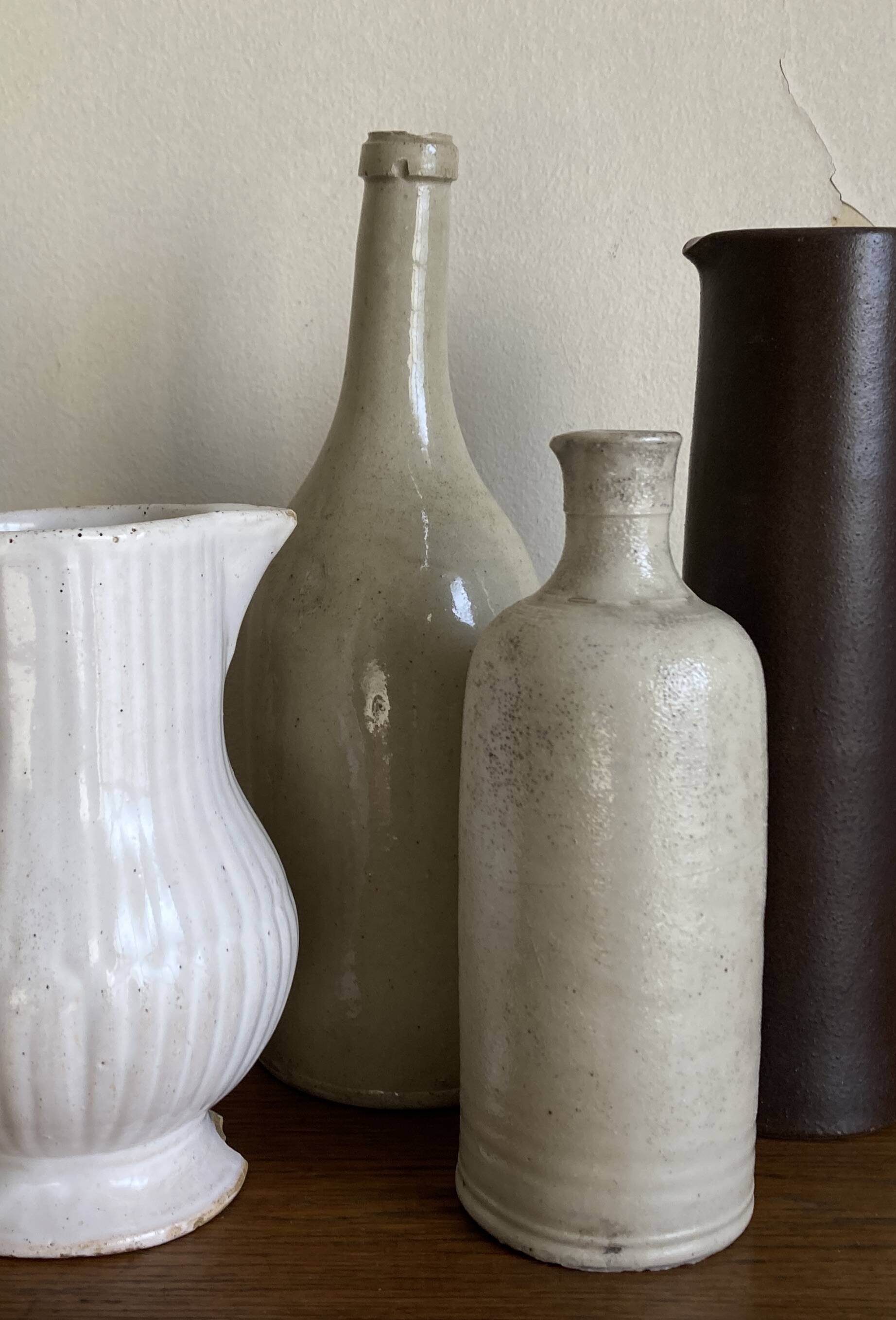 Stoneware bottle tilted at an angle, early 20th century