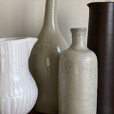 Stoneware bottle tilted at an angle, early 20th century