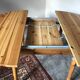 Round table in varnished pine with extension cord