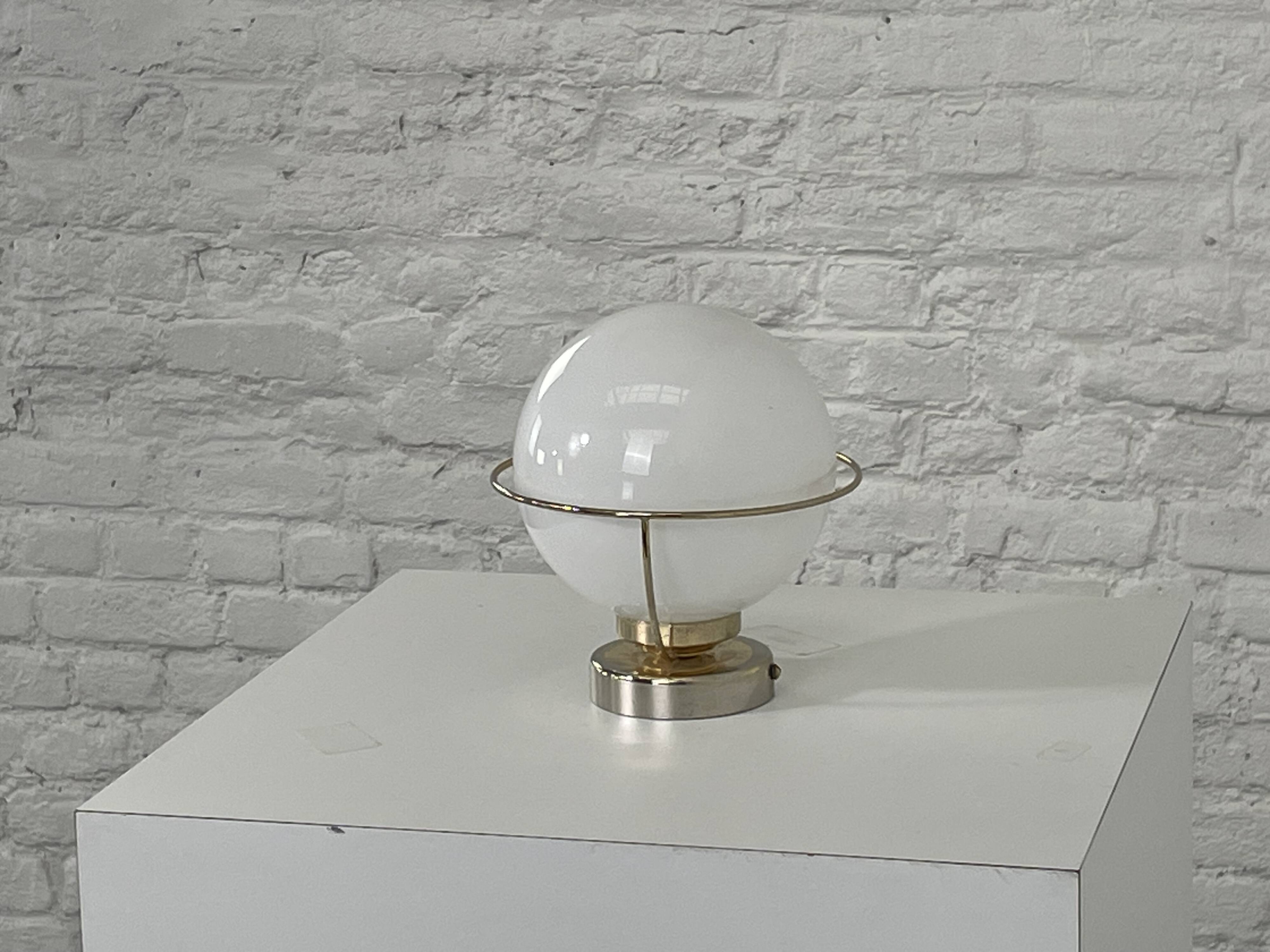 brass wall light from the 50s