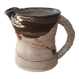 Signed ceramic pitcher. Glazed part. Worked cove