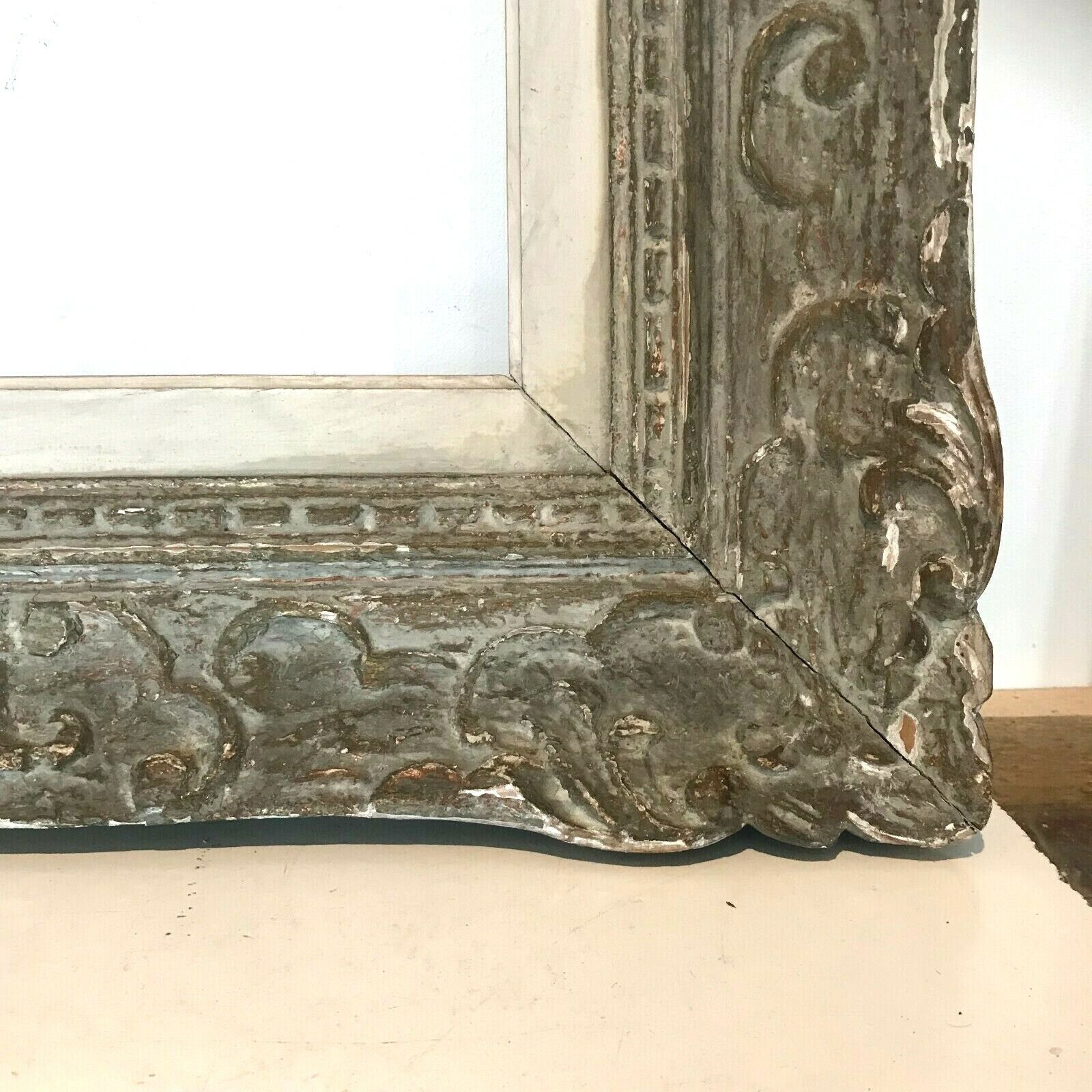 Wooden frame and patinated stucco XX century