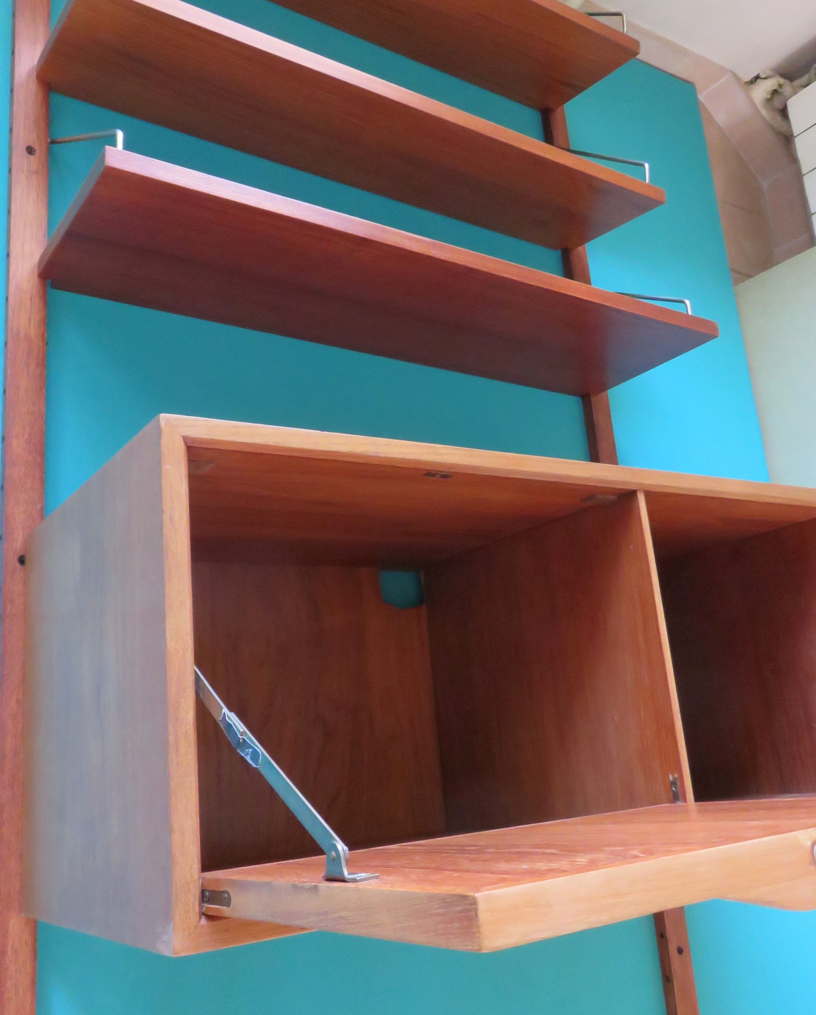 Wall shelving system and teak writing box. of Poul Cadovius. Denmark 1960